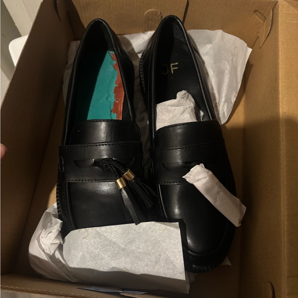 Black Loafers with Tassel Detail
